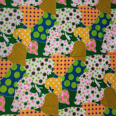 an image of colorful fabric with polka dots and fruit on it's surface in the style of children's clothing