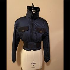 Vintage Nils Ski Jacket Size 6, Cinched Waist With An Elasticized Belt With Center Crest. The Belt Is Attached In The Back And Fastens In The Front With Velcro. Breast Flap Pockets That Open To A Zippered Pocket, Left Sleeve Zippered Pocket And Inside Zippered Pocket (Shown In Picture Of The Jacket Lining). It’s A Knockout On Or Off The Slopes! Vintage Ski Jacket, Jacket Lining, Vintage Ski, Snow Jacket, Faux Fur Collar, Ski Jacket, Fur Collar, Cinched Waist, Flap Pocket