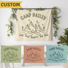 three camp wall hangings in different colors