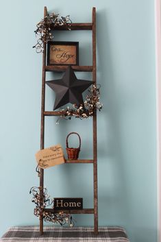 an old ladder is used as a shelf for decor