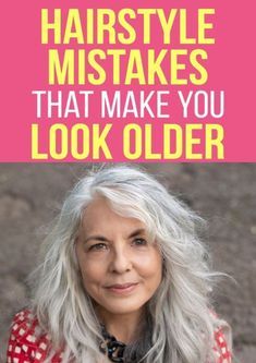 an older woman with grey hair wearing a red and white checkered shirt, standing in front of a pink background