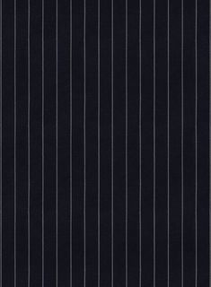 a black and white striped wallpaper with vertical lines on the bottom half of it