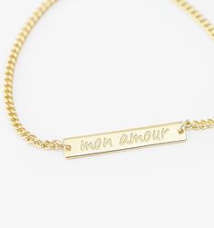 Who says subtle can't be powerful? The small bar bracelet keeps your reminder short and sweet on this polished piece of minimal thoughtfulness. Personalized Yellow Gold Rectangular Name Bracelet, Personalized Rectangular Yellow Gold Name Bracelet, Everyday Gold Nameplate Chain Bracelet, Gold Nameplate Chain Bracelet With Name, Gold Nameplate Chain Bracelet For Everyday Wear, Gold Nameplate Chain Bracelet, Gold Nameplate Chain Bracelet With Custom Name, Gold Rectangular Name Bracelets, Gold Personalized Name Bracelet Rectangular Shape