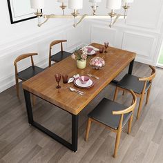 a dining table with four chairs around it