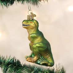 a christmas ornament shaped like a dinosaur