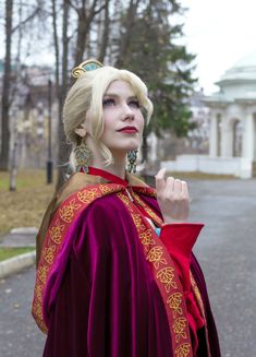 a woman dressed in costume poses for the camera