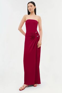 a woman in a strapless red dress