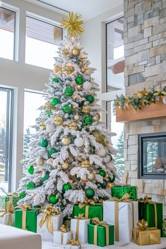 a white christmas tree with green and gold ornaments