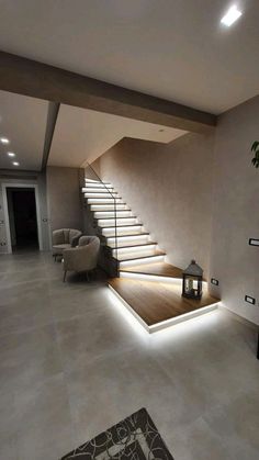 a living room filled with furniture and stairs