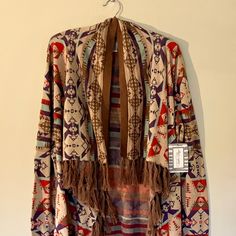 Super Soft, Lightweight Cotton Knit Cardigan/Shawl In Gorgeous Southwestern Pattern With Angled, Open Front And Fringe Along Edges And Hem. Sleeves Have Ribbed Cuffs. Drapes Beautifully And Adds A Southwestern Flair To Jeans Or A Skirt! Size M Length: 32” Back, 38” Front At Longest Point (Including Fringe) Pit To Pit: 22” (Designed To Be Roomy) About Tasha Polizzi / T.P. Saddleblanket Co. Tasha Polizzi Was An American Designer With A Lifelong Interest And Respect For Native American Culture. She Cardigan Shawl, Tasha Polizzi, Southwestern Patterns, Shawl Cardigan, Dryer Sheets, American Culture, Native American Culture, American Design, Cotton Knit