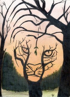 a drawing of a cat's face is shown in front of some bare trees