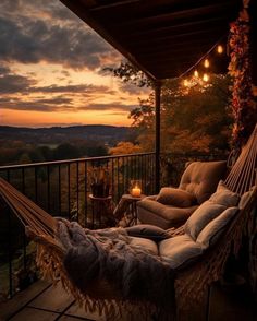 a hammock hanging from the side of a porch