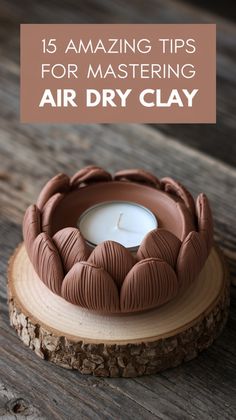 a candle sitting on top of a wooden table with text overlay that reads 15 amazing tips for mastering air dry clay