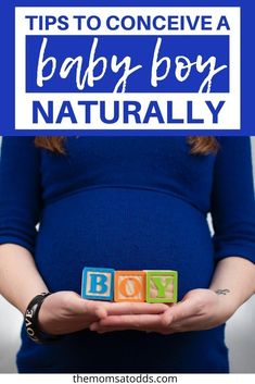 a pregnant woman holding blocks with the words tips to conceive a baby boy naturally