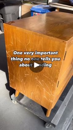 a wooden box sitting on top of a metal cart