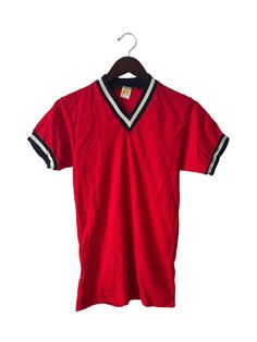 "70s russell athletic nylon v-neck. deadstock. NWOT. red with navy & white piping. 29\" long. 16.5\" across. 7.5\" arms. in excellent, unworn condition. made in USA. russell athletic founded in 1902. for the long run. legit. legitvintage.etsy.com legitvintage on instagram" Athletic Shirt Outfit, Retro Red Relaxed Fit Shirt, Vintage Red T-shirt For College, Red 90s Style Sports T-shirt, Vintage Russell Athletic, Red Collegiate Long Sleeve T-shirt, Gold Tag, 90s Fashion Men, Russell Athletic