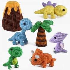 several crocheted toys are shown in different colors and sizes, including one dinosaur