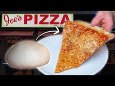 a slice of pizza on a plate with an egg in front of it and a sign for joe's pizza