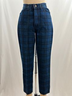 These 80s deadstock Chic denim are one of my faves! In a dark blue, they have a plaid design, a tapered leg and a high waist. Keep it simple with a white tee or add a striped one for a pattern on pattern look. -Vintage 80s -High waist, plaid design -Machine wash recommended  Measurements:  *Waist 12 inches *Hips 17 1/2 inches *Inseam 26 1/2  inches *Length 37  inches *This item is pre-loved and there may be minor flaws to the garment. Not to worry if there is anything major we will let you know. --Please read shop policies thoroughly relating to sizing, returns will not be accepted. I encourage you to ask questions for additional pictures, measurements, etc.-- Retro Blue Jeans For Fall, Vintage Blue Mid-rise Pants, Blue Retro Pants With Five Pockets, Retro Blue Pants With Five Pockets, Blue Retro Tapered Leg Bottoms, Retro Blue Tapered Leg Bottoms, Dark Blue Plaid, Singer Dr, Plaid Jeans