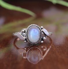 This beautiful stacking ring features a genuine moonstone gemstone in a oval design. Our blue fire moonstone is cut in a eclipse brilliant cut, which has an intense blue color with a hint of red undertones, and will add an elegant touch to any look. This makes the perfect engagement ring or bridal set, or can be worn as an everyday piece. The Product Specification Are As Below : Stone - Moonstone Stone Shape - Oval About Gemstone- Moonstones' healing properties help against nosebleeds, headaches, sunstroke, and epilepsy. These gemstones are also believed to help with the menstruation cycle and increase fertility. Unique design of this ring will make a special attraction for the wearer. Your order will dispatch within 2 days and you will receive it asap. For more Exciting and beautiful ring Christmas Ring, Gift For Mom Christmas, Moonstone Stone, Unique Holiday Gifts, Mom Christmas, Ring Minimalist, Minimalist Ring, Ring Oval, Blue Fire