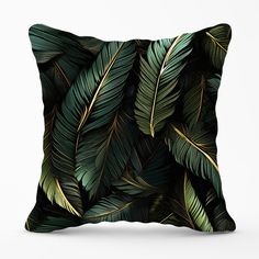 a pillow with green leaves on it