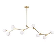 a brass chandelier with five white glass balls hanging from the middle of it