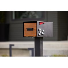 a mailbox with the number twenty four on it