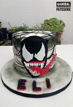 a spiderman birthday cake is decorated with fondant and spooky eyes for the decoration