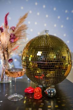 Made to order gold disco ball/ glitter ball punch bowls ✨ Can be used as a wine bucket🍾 or a bowl or cocktails 🍸  Can be customised with colour inside- from glitter, colour, leopard, print anything you can think 🌈  personalisation is for the inside colour only. These are 30cm and hold 2litres. 🥳 These are polystyrene balls (as a glitter ball is made) surrounded in glass mirrors. The inside painted and treated with resin. Please be aware these now come with a detachable CLEAR base, as we find these work best for transport🍾✨ let us know if you want a different base  Anymore questions email us or check our FAQS 🥰 Disco Ball Punch Bowl, Gold Disco Ball, Mirrored Tile, Glitter Ball, Wine Bucket, Glass Mirrors, Nye Party, Punch Bowls, Mirror Ball