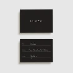 two black and white business cards with the word artfact written on one side