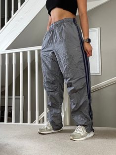 Amazing Vintage Starter Loose Fit Windbreaker Track Pants in Grey Colourway ❤️🔥 ⚡️⚡️ Specifics: Elasticated and Drawcord waist, side pockets, good condition check 4th pic, DM for more info. 📌 Measurements:  Tag says M unisex, easy fit for comfortable range of motion. 30"inner length 💙 Modelled on size 8, 5'4" as shown ✅ QUICK DISPATCH  #joggers #sportswear #tracksuitbottoms #baggypants #starter ------------------------------------------------------------- PLEASE READ: Overall GOOD vintage con 90s Style Full-length Pants With Side Pockets, 90s Full-length Pants With Side Pockets, 90s Style Sports Pants With Pockets, 90s Sporty Pants With Pockets, Windbreaker Track Pants, Tracksuit Bottoms, Range Of Motion, Baggy Fits, Track Pants