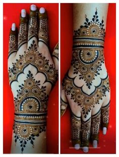 two hands with henna designs on them