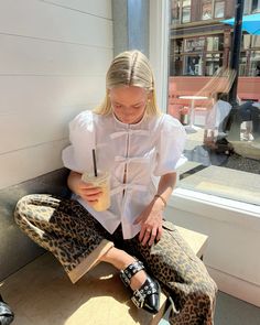 spring outfit inspo, leopard pants, how to style leopard pants, cool girl style, ganni girl, ganni girl style, ganni buckle ballerina flats, damson madder dion jeans, minimal style, coffee shop aesthetic, photo ideas, photo inspo, aesthetic photos to recreate, pinterest aesthetic, pinterest girl, outfit inspo, copenhagen style, classy style, gold jewelry, outfit inspo, heaven mayhem earrings, summer outfit inspo. Damson Madder Leopard, Damson Madder Leopard Jeans, Damson Madder Outfit, Ganni Outfit Ideas, Ballerina Flats Outfit Aesthetic, Damson Madder Aesthetic