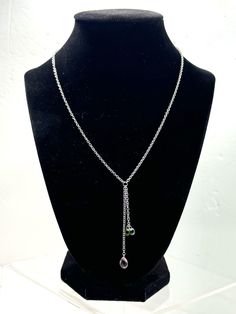 Add a touch of elegance to your outfit with this beautiful Sterling Silver Birthstone Lariat Necklace. The necklace is made of 925 silver and features a stunning combination of Peridot, Topaz, and Amethyst stones. The lariat style of the necklace is perfect for adding a touch of sophistication to any outfit. This necklace is a great addition to your jewelry collection and is perfect for any occasion. The combination of the three stones, Peridot, Topaz, and Amethyst, makes this necklace a unique and beautiful piece. Order now and add this stunning necklace to your collection. Silver Lariat Necklace, Lariat Necklace Silver, Amethyst Stones, Stunning Necklace, Lariat Necklace, Amethyst Stone, Three Stone, Topaz, 925 Silver