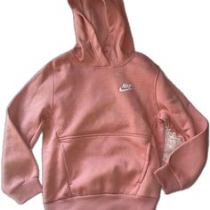 Nike Hoodie With Ribbed Cuffs For Spring, Pink Adjustable Hood Sweatshirt For Spring, Pink Spring Sweatshirt With Adjustable Hood, Spring Pink Sweatshirt With Adjustable Hood, Pink Nike Hoodie With Crew Neck, Nike Fleece Hoodie For Spring, Pink Hooded Top With Kangaroo Pocket, Nike Spring Sweatshirt With Drawstring Hood, Nike Hoodie For Spring