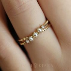 18k Solid Gold Criss Cross Ring, Three Mini Freshwater Pearls Diamonds Ring, June Birthstone, Dainty Everyday Ring, Real Pearl Causal Rings DETAILS ♡⃛ ⃛ Main stone: Freshwater Pearl Side stone: Moissanite/ Diamond Band width: 1.5mm Band thickness: 1.2mm OUR GEMSTONES ♡⃛ ⃛ At Kiseki Kiara, we use both precious and semi-precious stones throughout our jewelry designs, with each stone set-by-hand in our workshop. We carefully source gemstones for their quality and color ensuring you receive the best