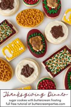 decorated cookies with buttercream frosting are arranged on a white surface for thanksgiving dinner