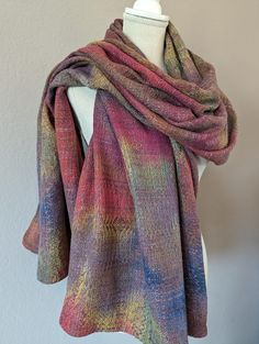 Earth tone colors blend and layer like our planet's tapestry. Wrap up in this gorgeous, hand dyed hand woven shawl. Silky soft, US grown and milled Supima cotton warp features hand dyed bands of loamy brown, clay, terracotta, gold, leaf green, and navy. Hand dyed kapok modal weft in light copper brown interweaves in a large scale, textured crackle weave pattern. Kapok is a natural fiber that is wonderfully insulating, making this shawl a cozy choice for cool weather outer wear. Measures a generous 32" wide by 82" long. Dress up an evening outfit with this handwoven shawl, or wear as a blanket scarf to feel fabulous by day.  50% Cotton 25% Kapok 25% Modal Wash separately in cool water with mild detergent by hand. No bleach. Flat dry. Cool iron as needed. Please check my other listings for m Crackle Weave, Light Copper Brown, Handwoven Shawls, Brown Clay, Evening Outfit, Earth Tone Colors, Copper Brown, Light Copper, Outer Wear