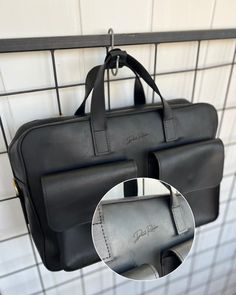 This personalized leather men's briefcase is the ultimate blend of style and functionality, making it an ideal laptop bag and work companion. Crafted from high-quality leather, this black satchel offers a sleek design with ample space for a laptop and other essentials, ensuring you stay organized on the go. Perfect for professionals, this men's shoulder bag is not just a practical accessory but also a thoughtful birthday gift. Its personalized touch adds a unique element, making it a standout pi Rectangular Black Leather Briefcase, Black Tote Laptop Bag For Business, Modern Rectangular Bags For The Workplace, Black Leather Laptop Bag With Luggage Sleeve, Functional Business Tote Briefcase, Black Rectangular Briefcase With Luggage Sleeve, Modern Leather Bags For The Workplace, Modern Leather Bag For The Workplace, Modern Leather Bag For Workplace