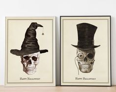 two halloween cards with skulls wearing hats and one has a skull in the top hat