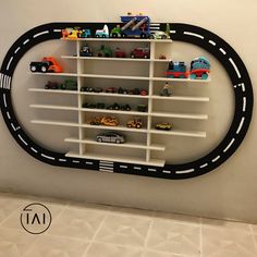 a wall shelf with cars and trucks on it