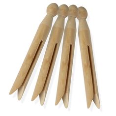 six wooden pegs are lined up on top of each other