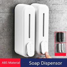 two white soap dispensers on the wall with magnets attached to them