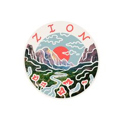 a round sticker with the word nom on it and mountains in the background