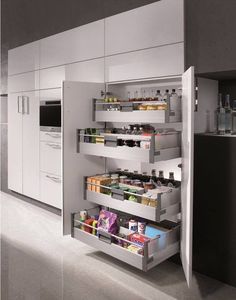 an open refrigerator door in a kitchen filled with food