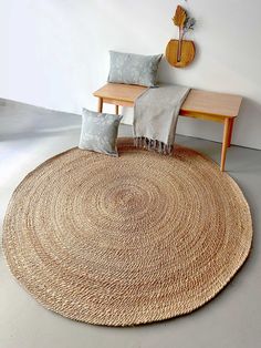 A round jute rug can be a versatile and stylish addition to various areas in your home. Here are some popular places and occasions where you might consider using a round jute rug: Living Room: Place a round jute rug under a coffee table or in the center of your seating arrangement to define the space and add a natural, earthy touch to the room. Dining Area: If you have a round dining table, a round jute rug can complement the shape and add warmth to the dining area. Ensure that the rug is large Round Table With Round Rug, Round Rugs Dining Table, Round Jute Rug, Small Sitting Area, Jute Round Rug, Popular Places, Living Room Nursery, Braided Jute Rug, Rug For Living Room