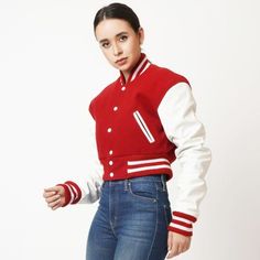 Women's Cropped Varsity Leather Jacket In Red & White Sleeves Experience a blend of style and comfort with this women's cropped varsity leather jacket. Crafted from genuine cowhide leather and wool, this semi-aniline jacket features a cozy viscose lining. Its rib knit collar, snap button closure, and rib knit cuffs add a classic varsity touch. Equipped with one inside pocket and two open hem side pockets, it's perfect for keeping essentials. The striking red and white color scheme makes it a vibrant addition to any wardrobe. Outer Shell: Genuine Leather And Wool Leather Type: Cowhide Leather Finish: Semi-aniline Inner Shell: Viscose Lining Closure Style: Snap Buttons Collar Style: Rib Knit Cuffs Style: Rib Knit Inside Pockets: One Outside Pockets: Two Open Hem Side Pockets Color: Red & Whi Varsity Leather Jacket, Trendy Leather Jacket, Varsity Design, Leather Shorts Women, Short Leather Skirts, White Sleeves, Leather Jumpsuit, Distressed Jacket, Sheepskin Jacket