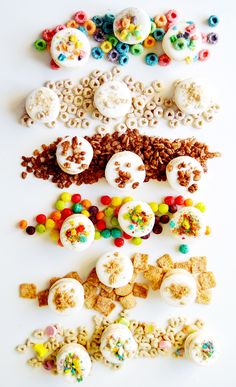 an assortment of cereals and buttons on a white surface with the word's spelled out