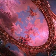 an ornate painted ceiling in a building