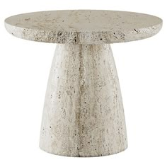 a white table with a round top and two small legs on the base, made out of concrete